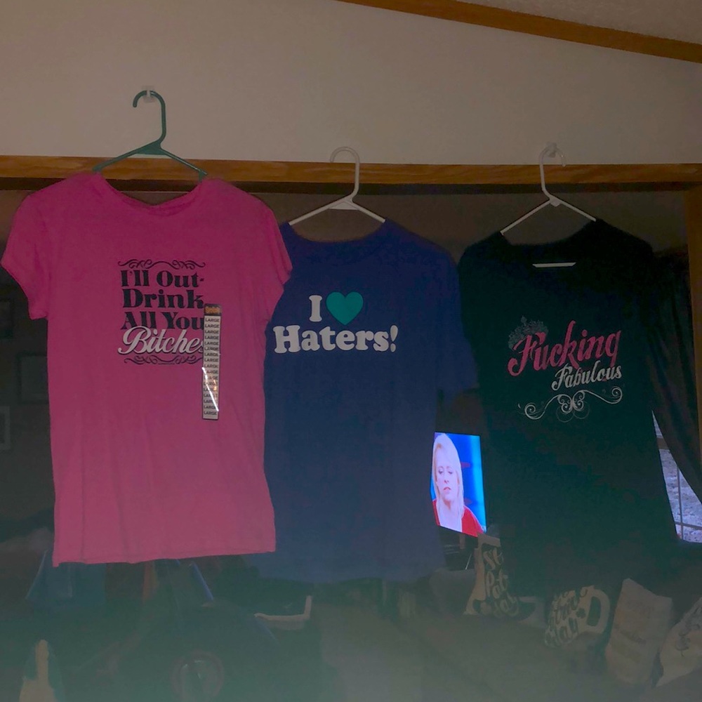 Lot of large silly saying shirts
